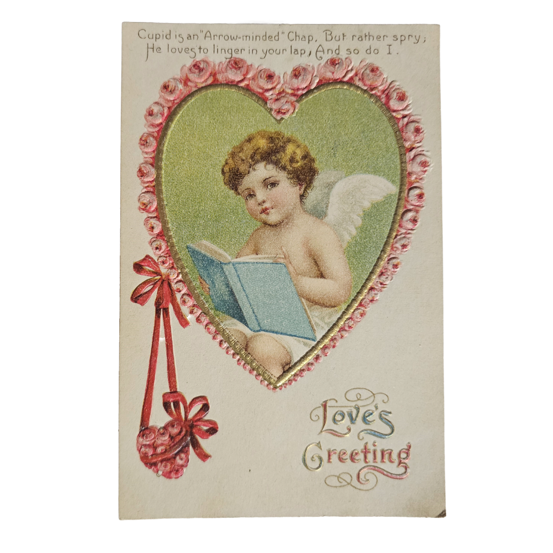 Vintage Valentine Postcard Cupid Reading Storybook In Heart Border