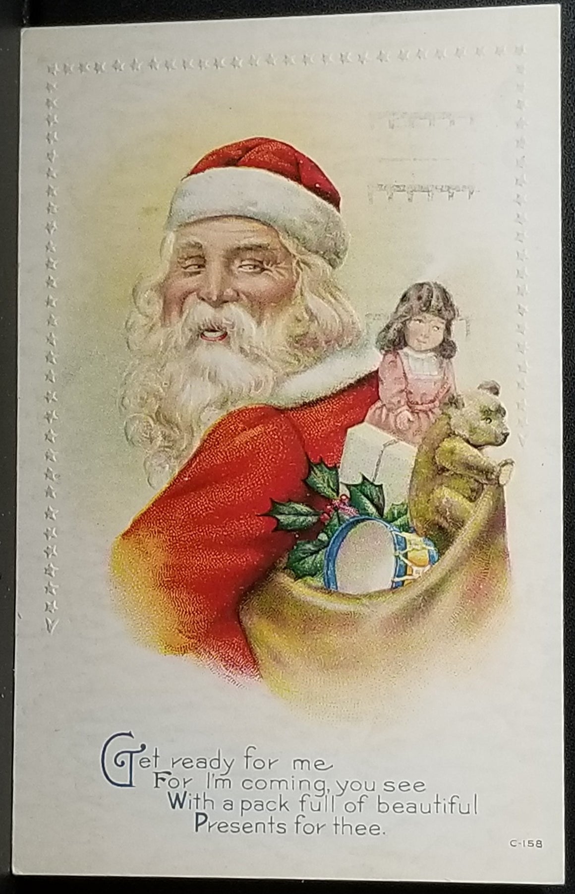 Christmas Postcard Santa Claus Profile Image Kris Kringle Smiling with Bag of Toys