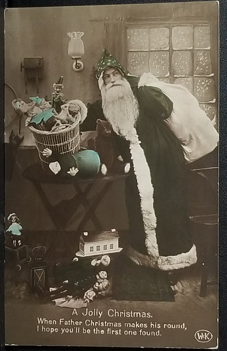 Real Photo Style Postcard Hand Tinted Santa Claus in Green Robe Bringing Toys