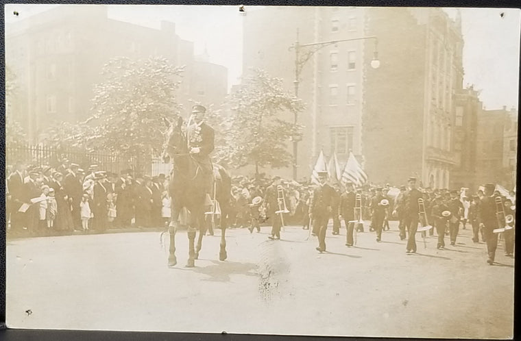 RPPC Real Photo Postcard 1910s Parade with Military Dressed Man on Horse Leading Band
