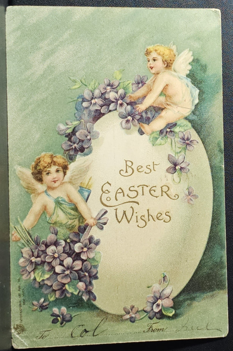 Easter Postcard Baby Cherub and Angel Child Holding Violets with Giant Egg Intl Art Pub Early Undivided
