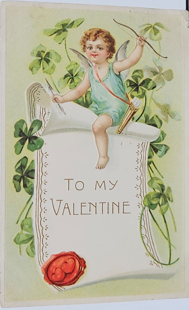 Valentine Postcard Embossed Card Cupid Over Banner with Four Life Clovers Printed in Germany