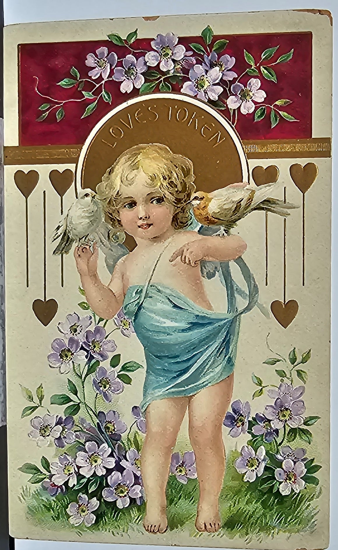 Valentine Postcard Gold Embossed Cupid Girl in Garden Holding Doves Embossed Printed in Germany