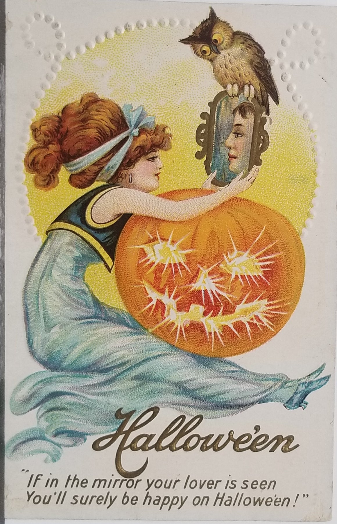 Halloween Postcard Glamour Girl Red Haired Witch in Blue Dress Holding Giant JOL with Owl on Mirror with Man's Reflection 216