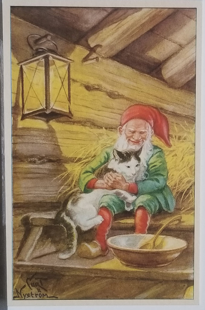 Christmas Theme Postcard Swedish Artist Kurt Nystrom Elf in Green Red Suit Holding Large Cat in Hay