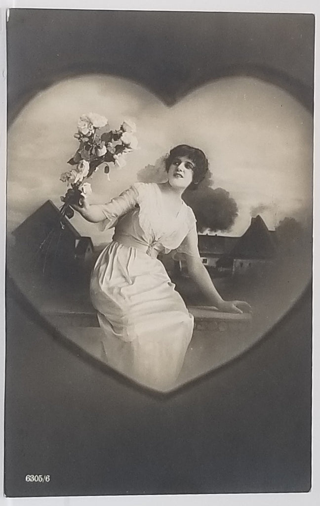Artist Postcard Woman in Heart Frame Holding Flowers House Scene in Background Monochromatic Color