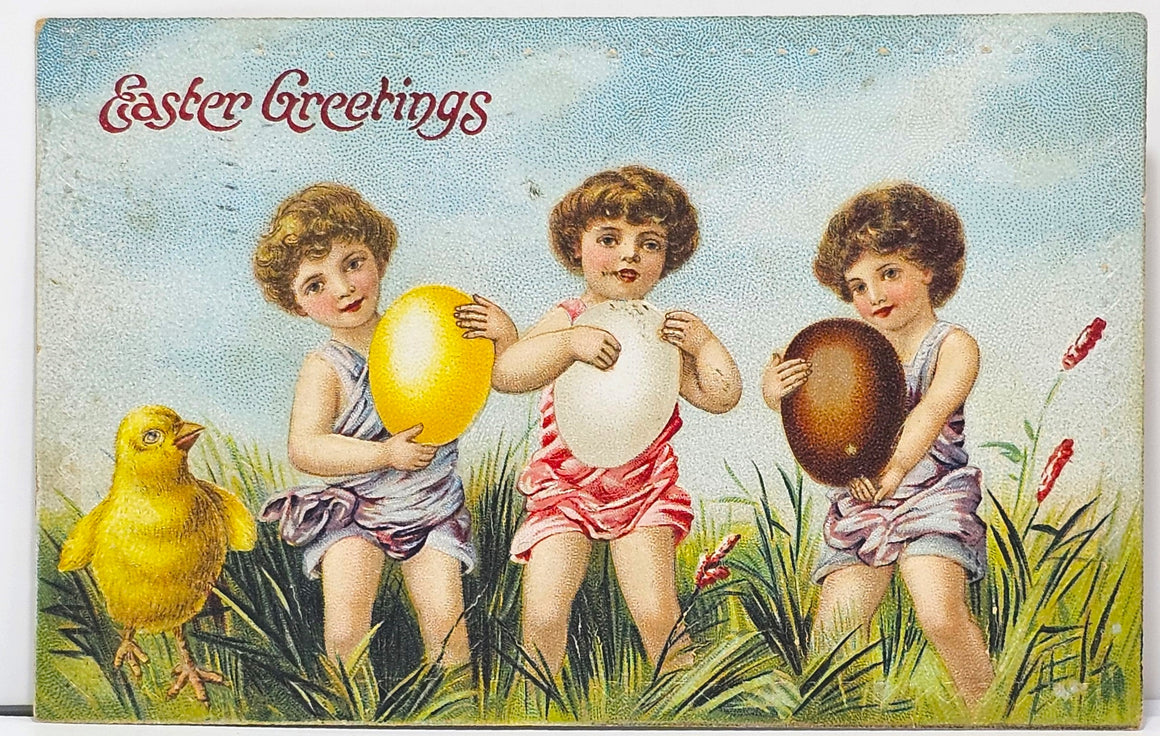 Easter Postcard Three Angel Cupid Girls Holding Large Painted Eggs Amongst Tall Grass with Baby Chick