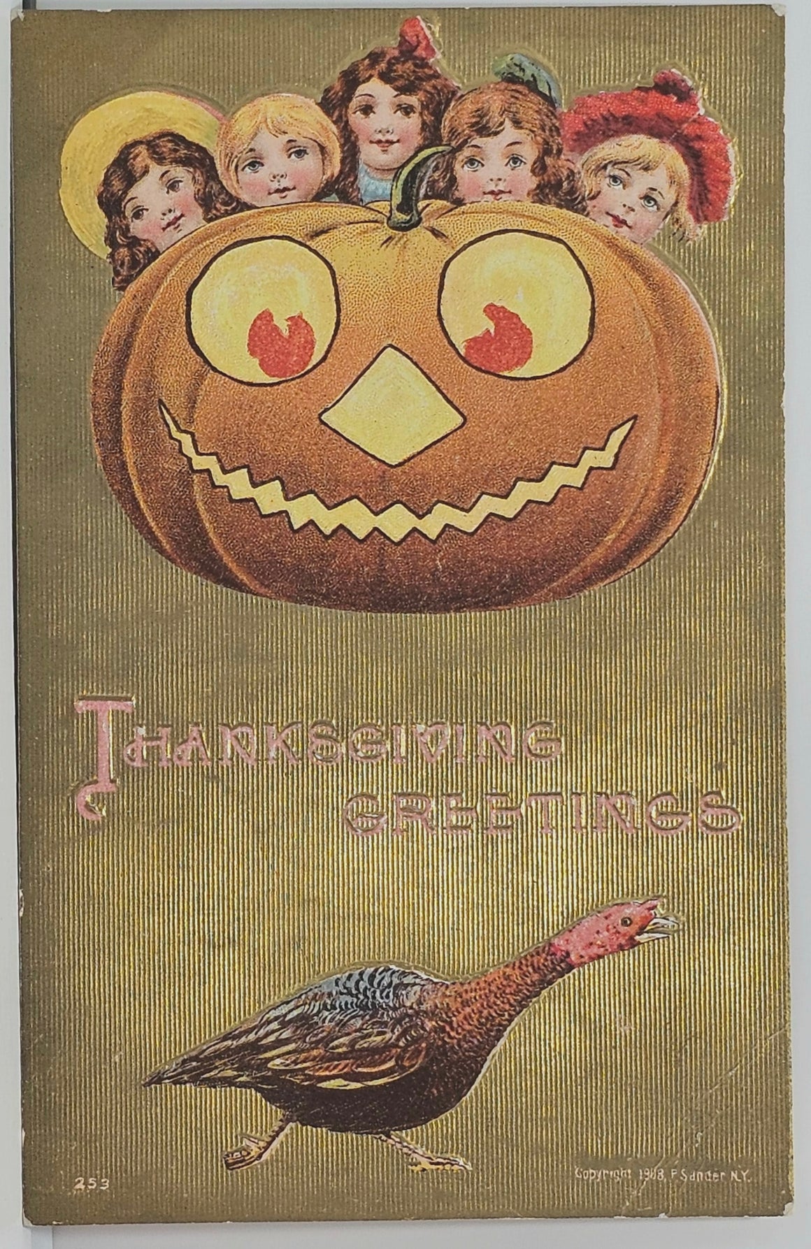 Thanksgiving Postcard Halloween Crossover Card Giant Lit JOL with Children Hiding Behind Added Turkey at Bottom