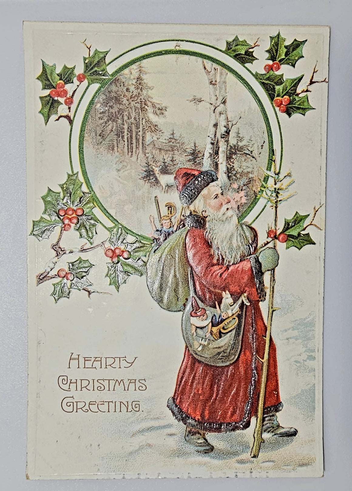 Christmas Postcard German Old World Santa Claus in Snow Holding Walking Stick Holly Trim
