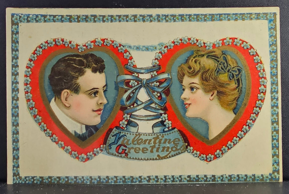 Valentine Postcard Edwardian Couple Portrait Faces in Hearts with Blue Flower Border