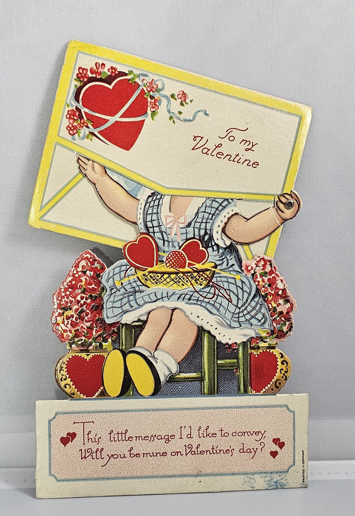 Vintage Die Cut Mechanical Valentine Little Girl in Blue Dress with Hearts & Flowers Hiding in Giant Envelope