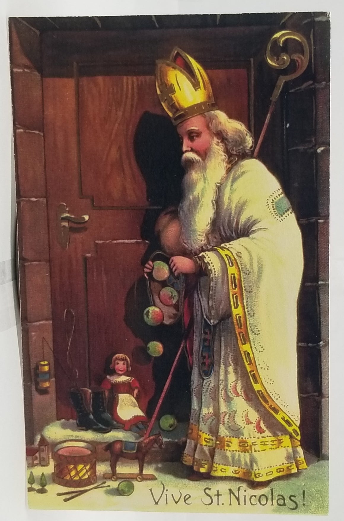 Christmas Postcard Old World White Robed Santa Claus Netherlands Leaving Toys and Fruit at a Large Door