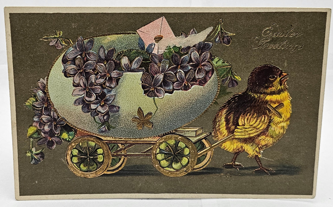 Easter Postcard Embossed Baby Chick Pulling Egg Wagon Filled with Purple Violets Gold Highlights