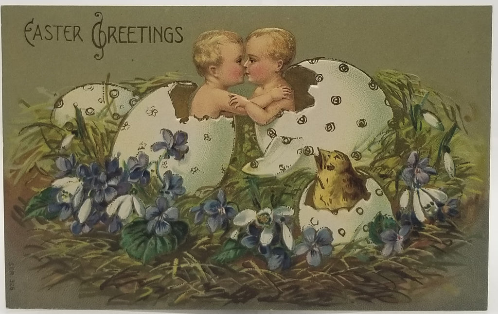 Easter Postcard Gold Embossed Kissing Babies in Eggs Nest of Flowers Series 326