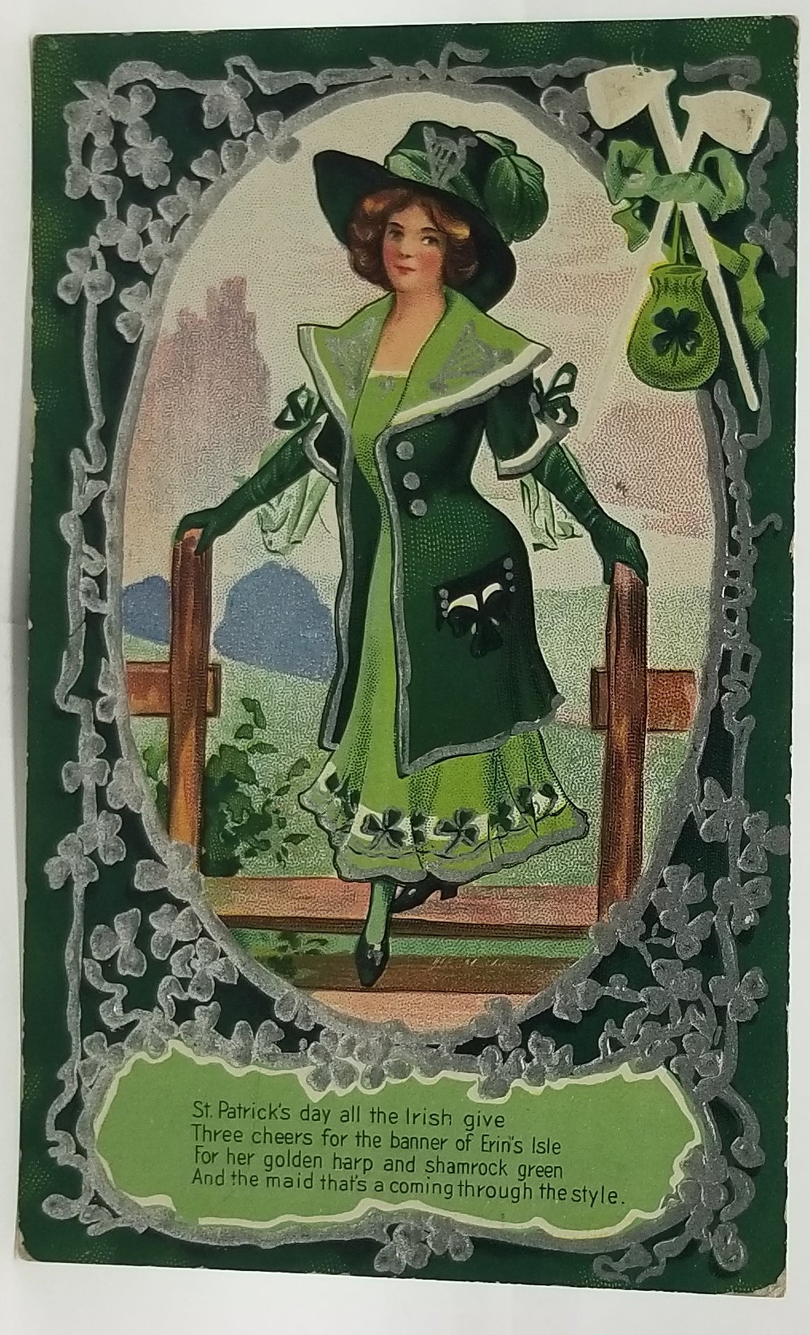 St Patrick's Day Postcard Silver Embossed Card Irish Woman in Green White Pipes Pot of Gold in Corner No 3