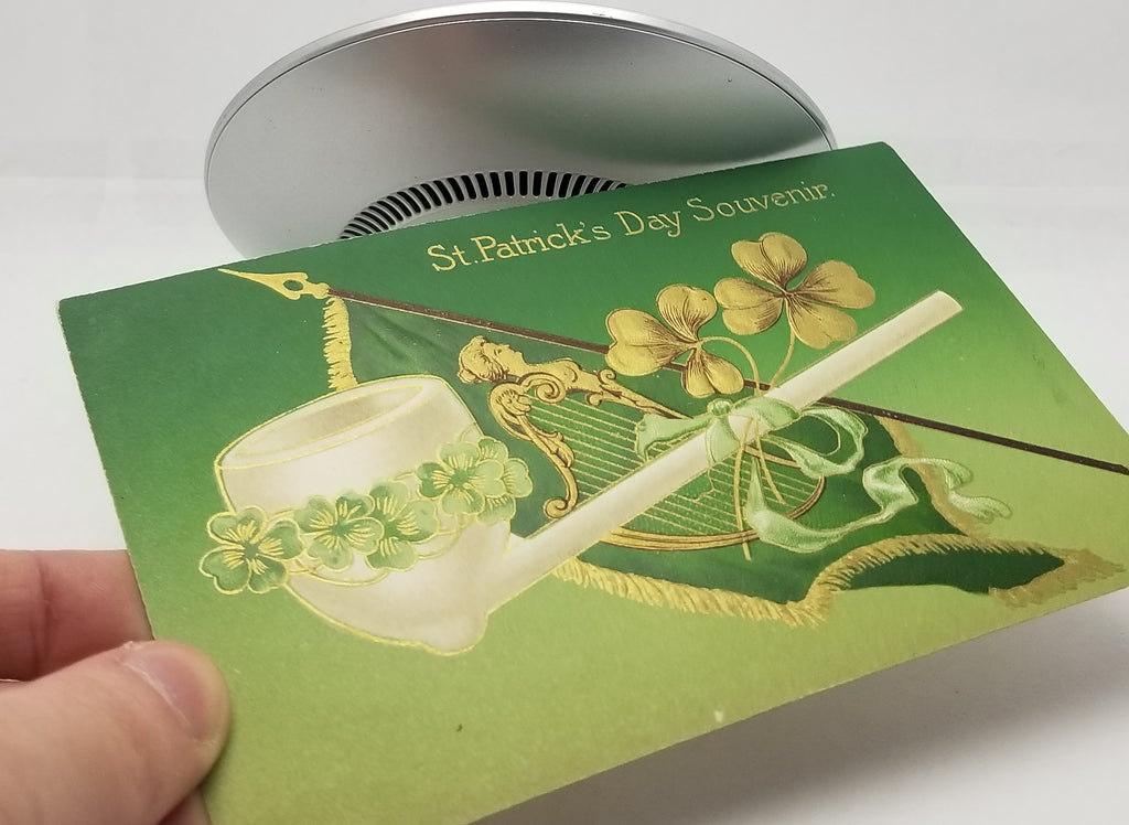 St Patrick's Day Postcard Gold Embossed White Pipe with Shamrock Clover Over Irish Flag John Winsch Publishing