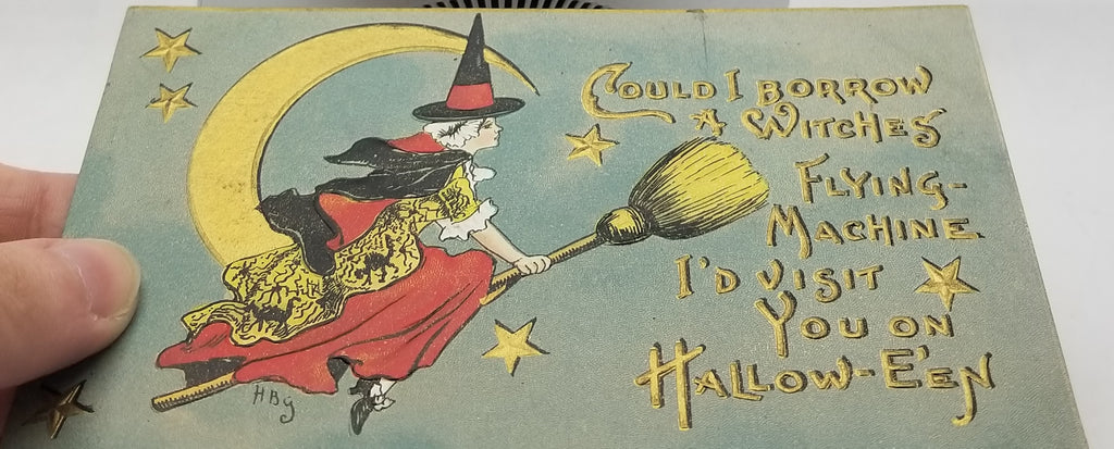 Halloween Postcard Series 2262 Artist HB Griggs Witch in Red Dress on Broom with Gold Embossed Moon & Stars with Gold Writing