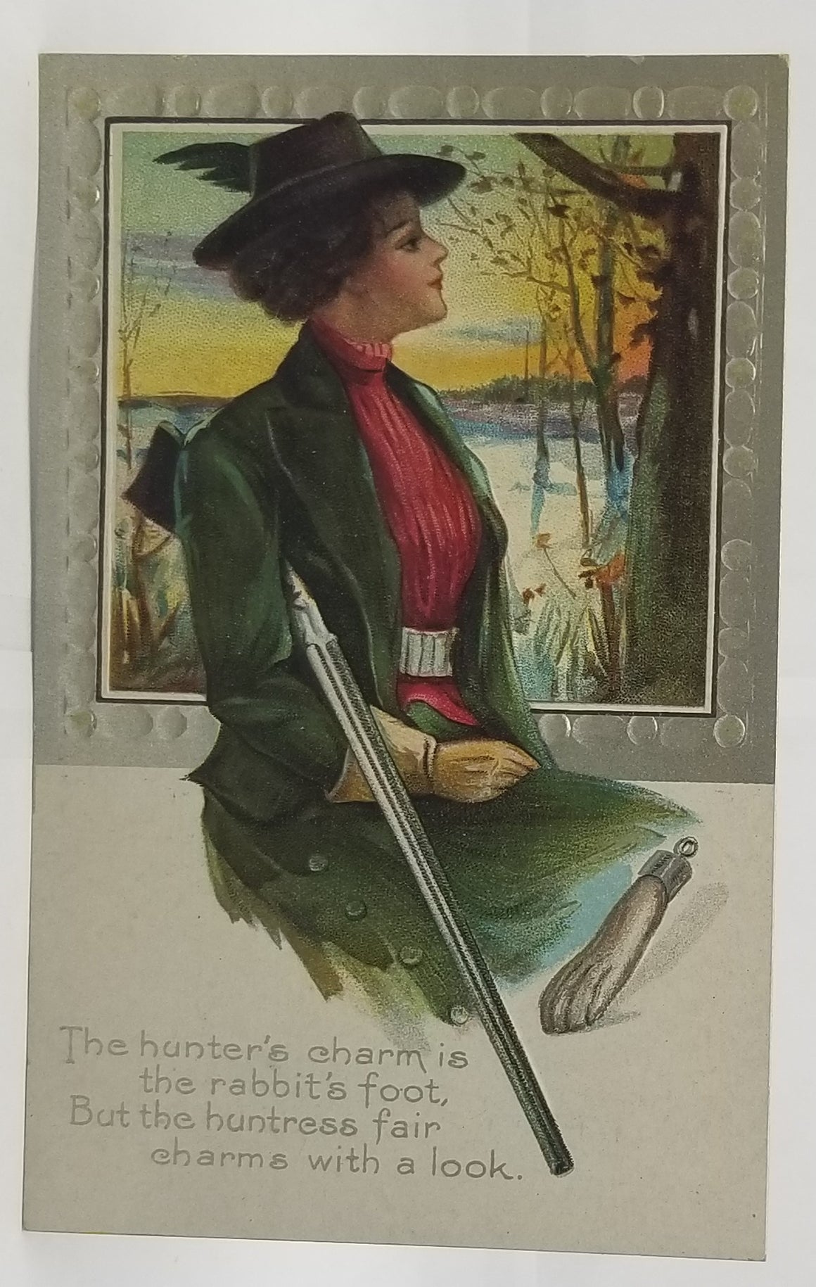 Thanksgiving Postcard Woman Huntress Holding Rifle with Lucky Rabbit's Foot Silver Border