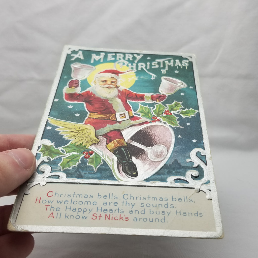 Christmas Postcard Santa Claus Ringing Bells While Riding Giant Bell Kris Kringle Series 1 Silver Highlights