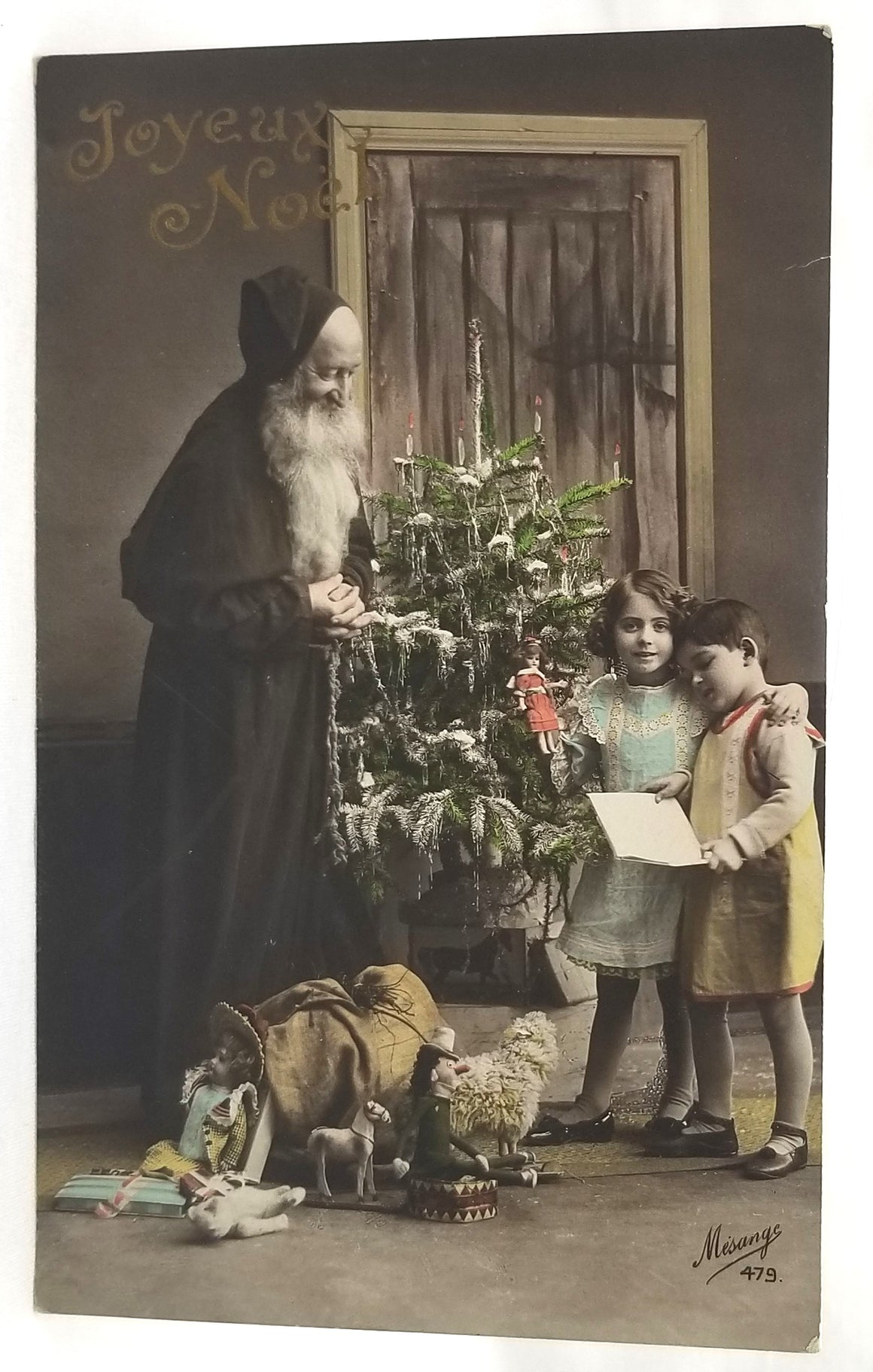 Christmas Postcard Santa Claus RPPC Real Photo St Nicholas Handing Toys to Children Near Tree Hand Tinted