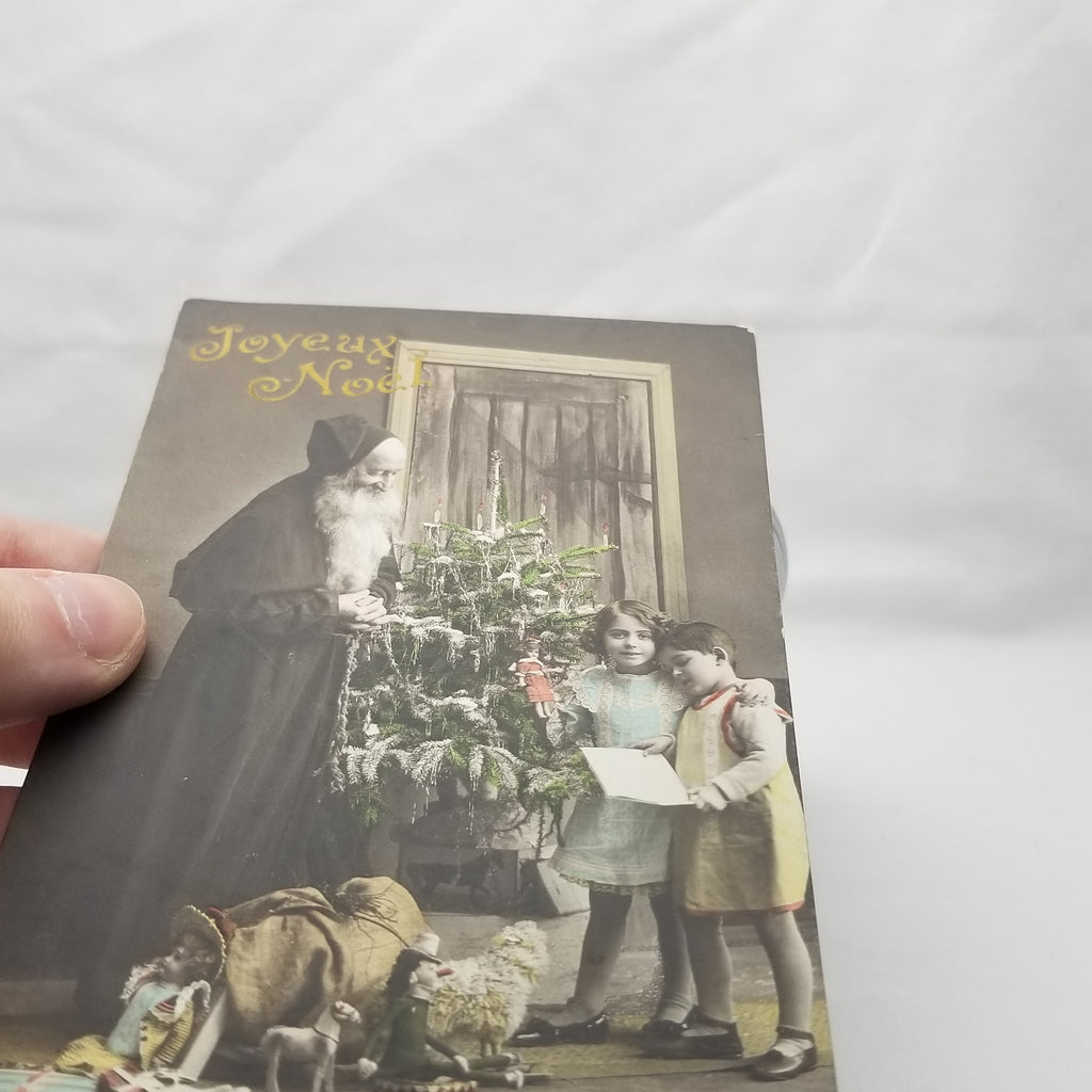 Christmas Postcard Santa Claus RPPC Real Photo St Nicholas Handing Toys to Children Near Tree Hand Tinted