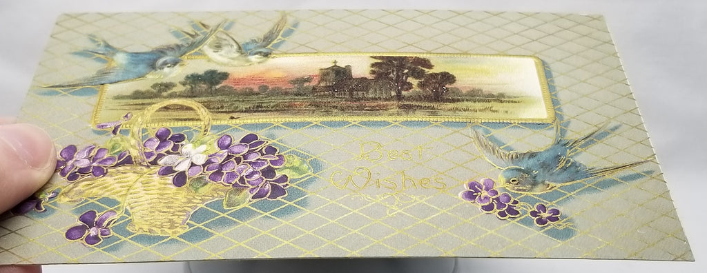 Greetings Postcard Best Wishes Blue Birds Basket of Violets with Gold Trim Embossed Unused Card