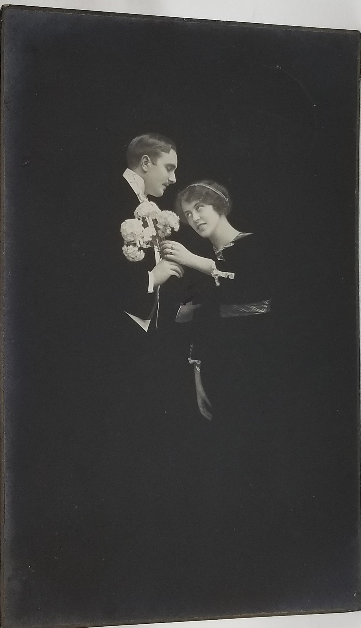 Real Photo Style Postcard Fade Away Couple Black Background Man Giving Woman White Flowers RPPC