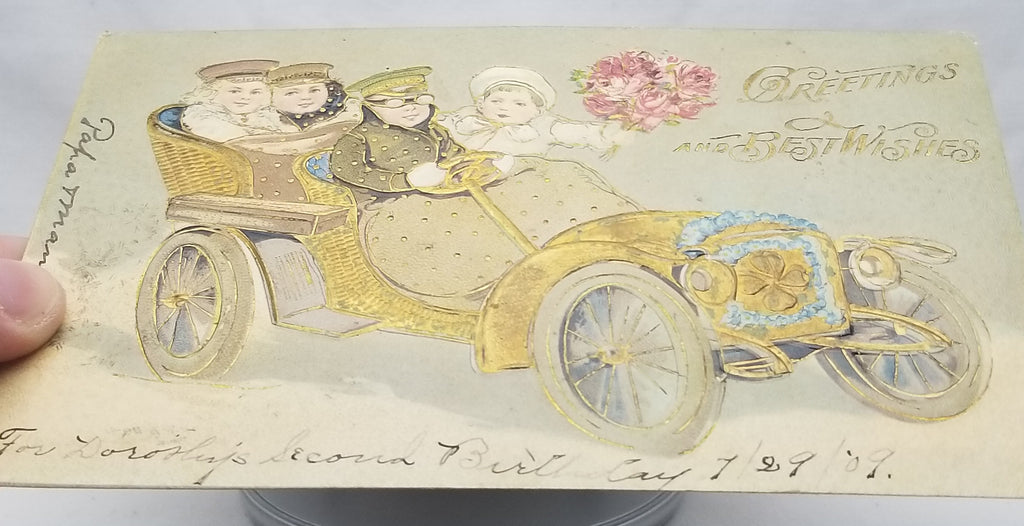 Gold Embossed Best Wishes Postcard Children in Old Timey Car