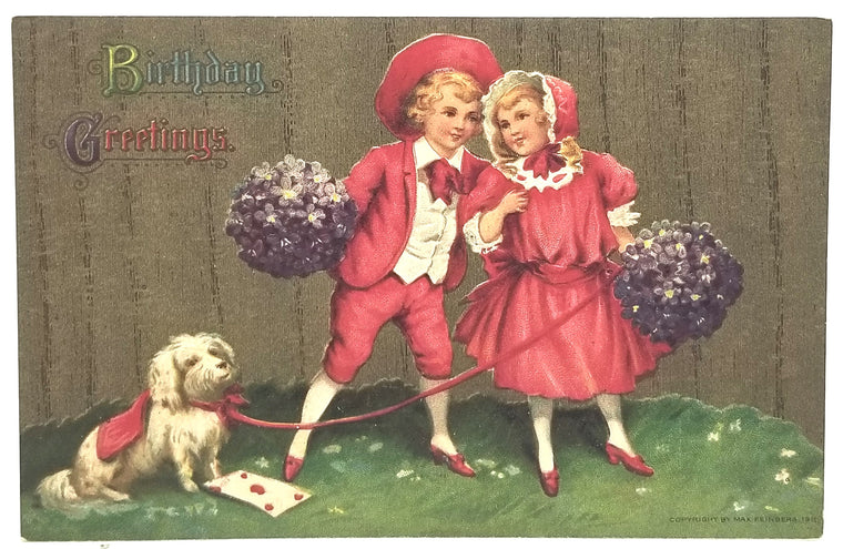 Vintage birthday card with children in red outfits and a dog holding flowers.