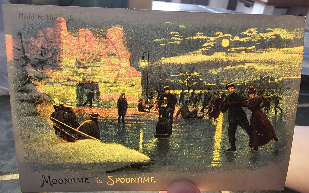 Antique Novelty Hold To Light Postcard, German HTL Card with Ice Skating Couples Under Moon Light Makes Snow Glow Moon Time is Spoon Time