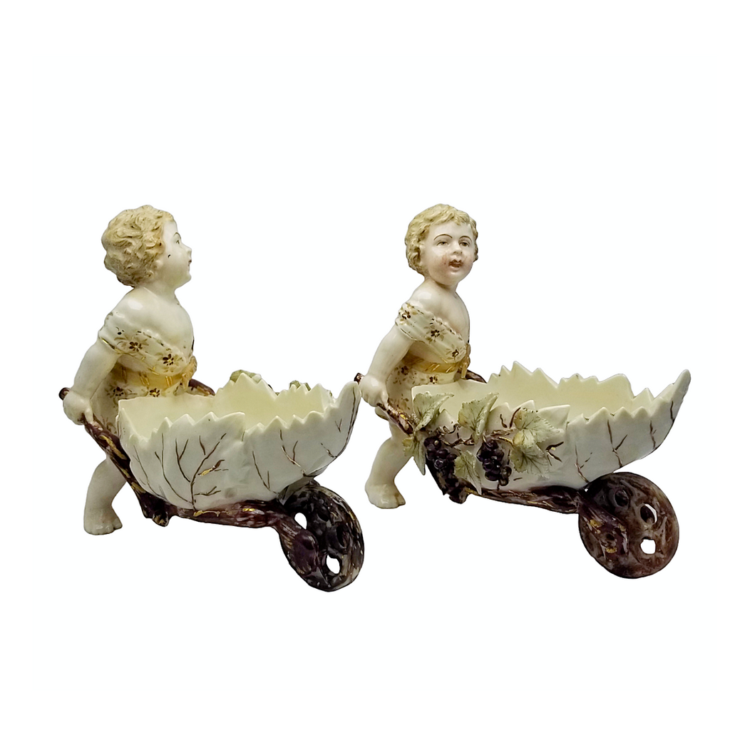 Volkstedt Garden Putti Cherubs Pushing Wheelbarrows with Moving Wheels
