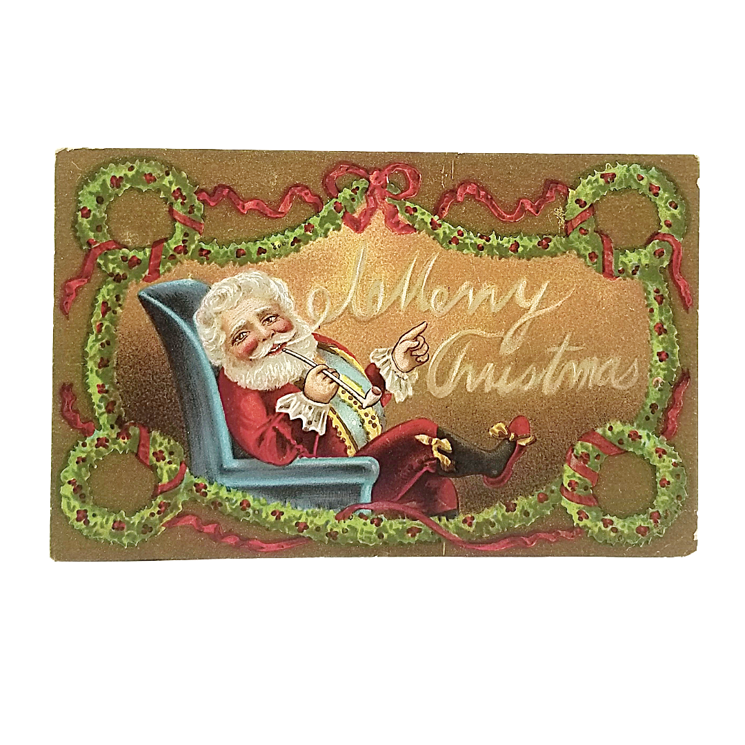 Christmas Postcard Santa Claus with Fire Smoking Pipe in Chair Wreath Border