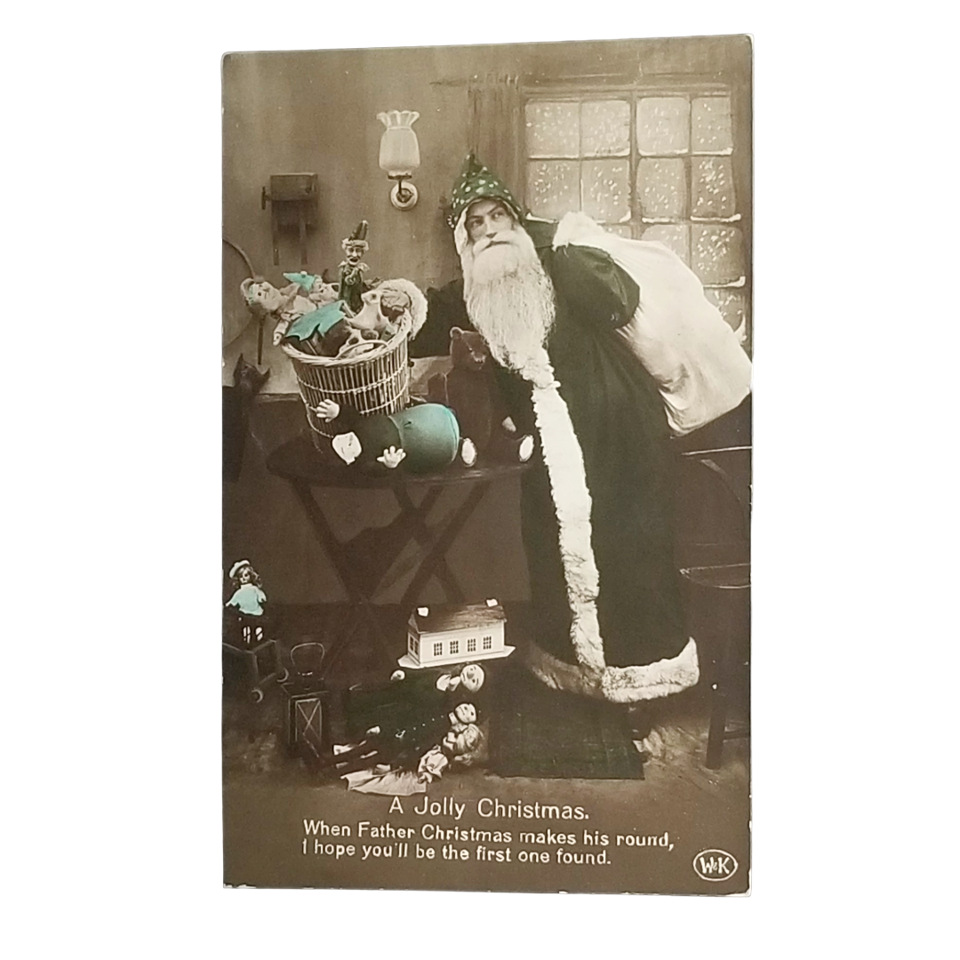 Real Photo Style Postcard Hand Tinted Santa Claus in Green Robe Bringing Toys