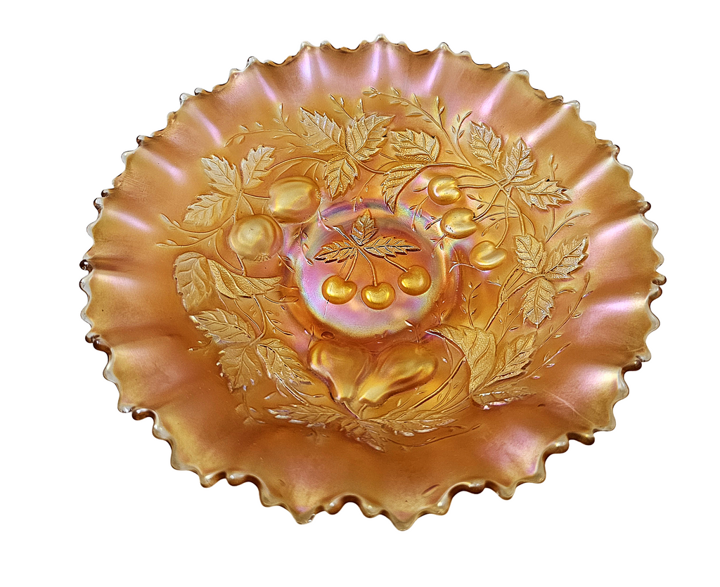 Decorative glass bowl with floral and fruit design on a white background