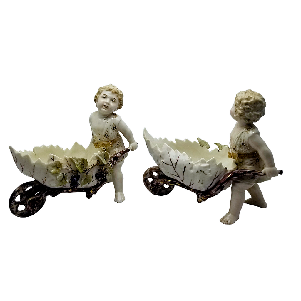 Volkstedt Garden Putti Cherubs Pushing Wheelbarrows with Moving Wheels