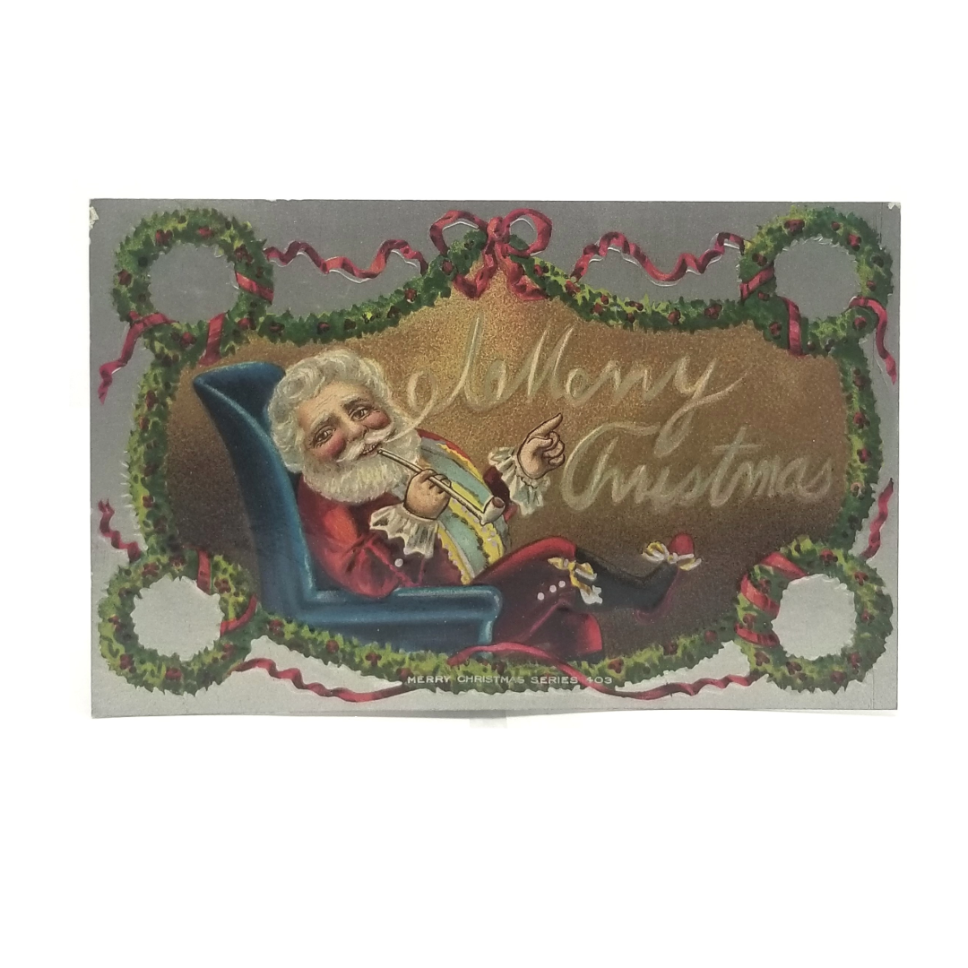 Christmas Postcard Santa Claus with Fire Smoking Pipe in Chair Silver Background