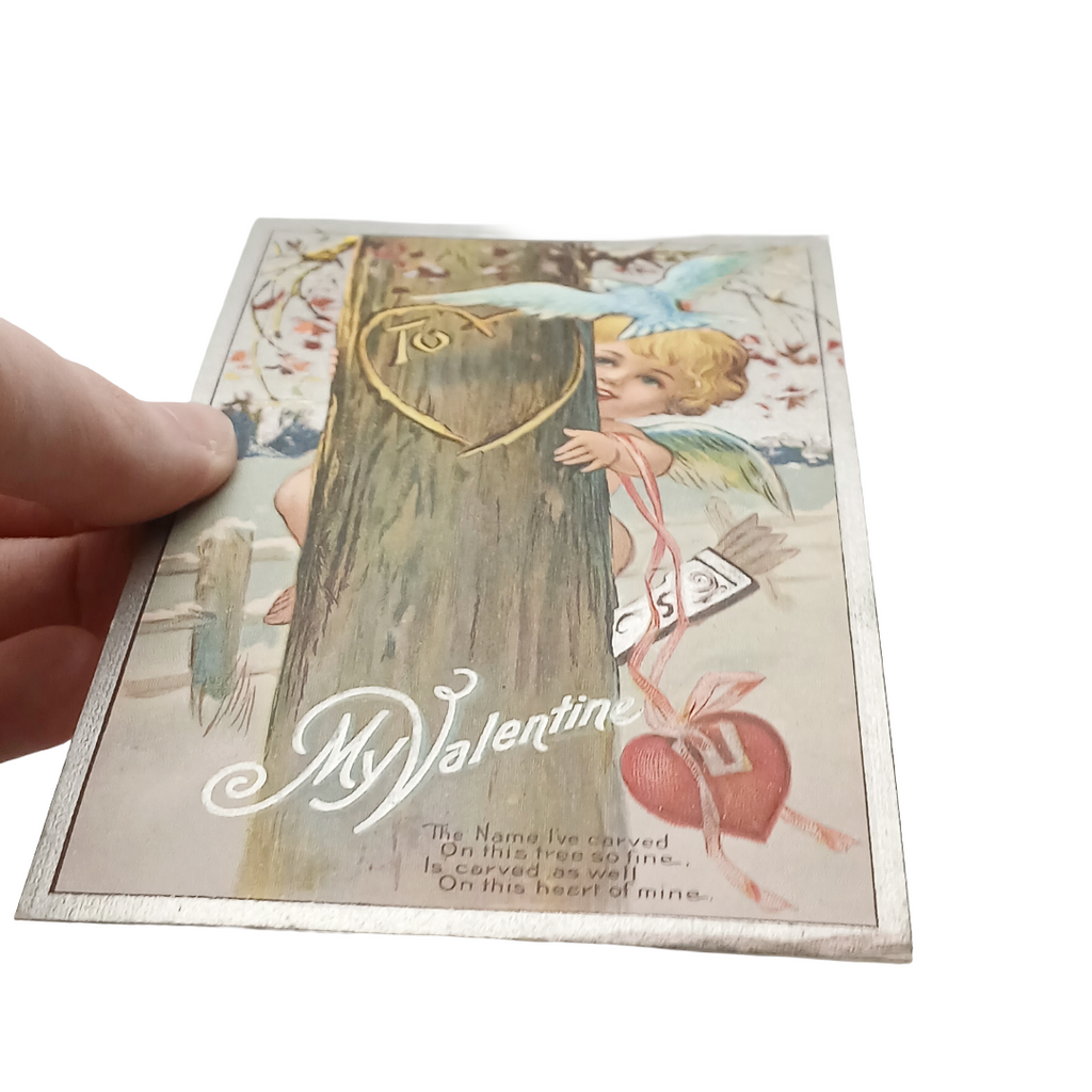 Vintage Valentine Postcard Cupid Behind Tree with Bluebird Silver Embossed