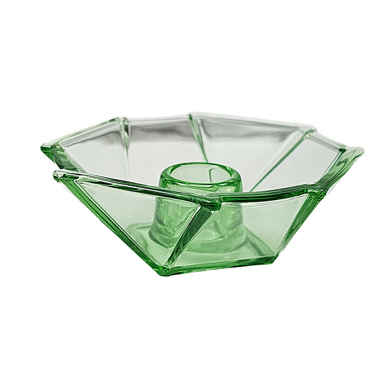 A clear green glass bowl with a faceted, geometric design and a central pedestal base, shown on a plain white background.
