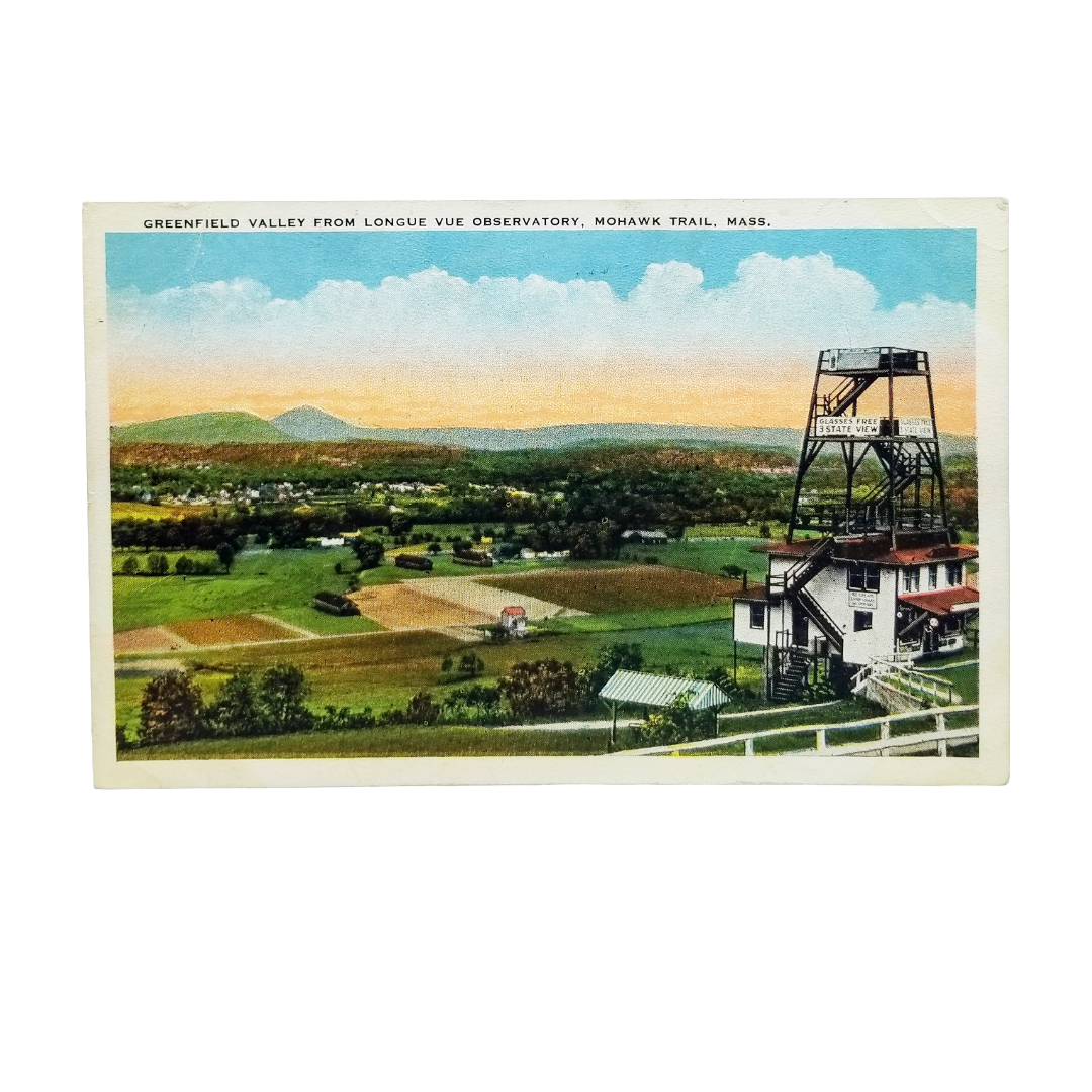 A vintage postcard showing a scenic landscape of Greenfield Valley from Longue Vue Observatory, Mohawk Trail, Mass., with a painted view of fields, mountains, sky, and a large industrial tower on the right.