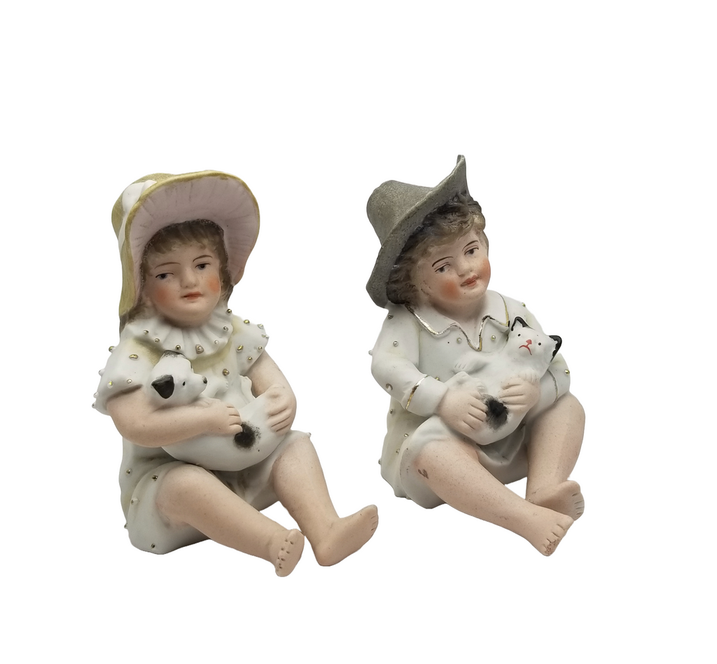 German Porcelain Bisque Piano Baby Pair Two Statues Figurines Boy Holding Kitty Cat Girl Holding Puppy Dog Heubach Quality