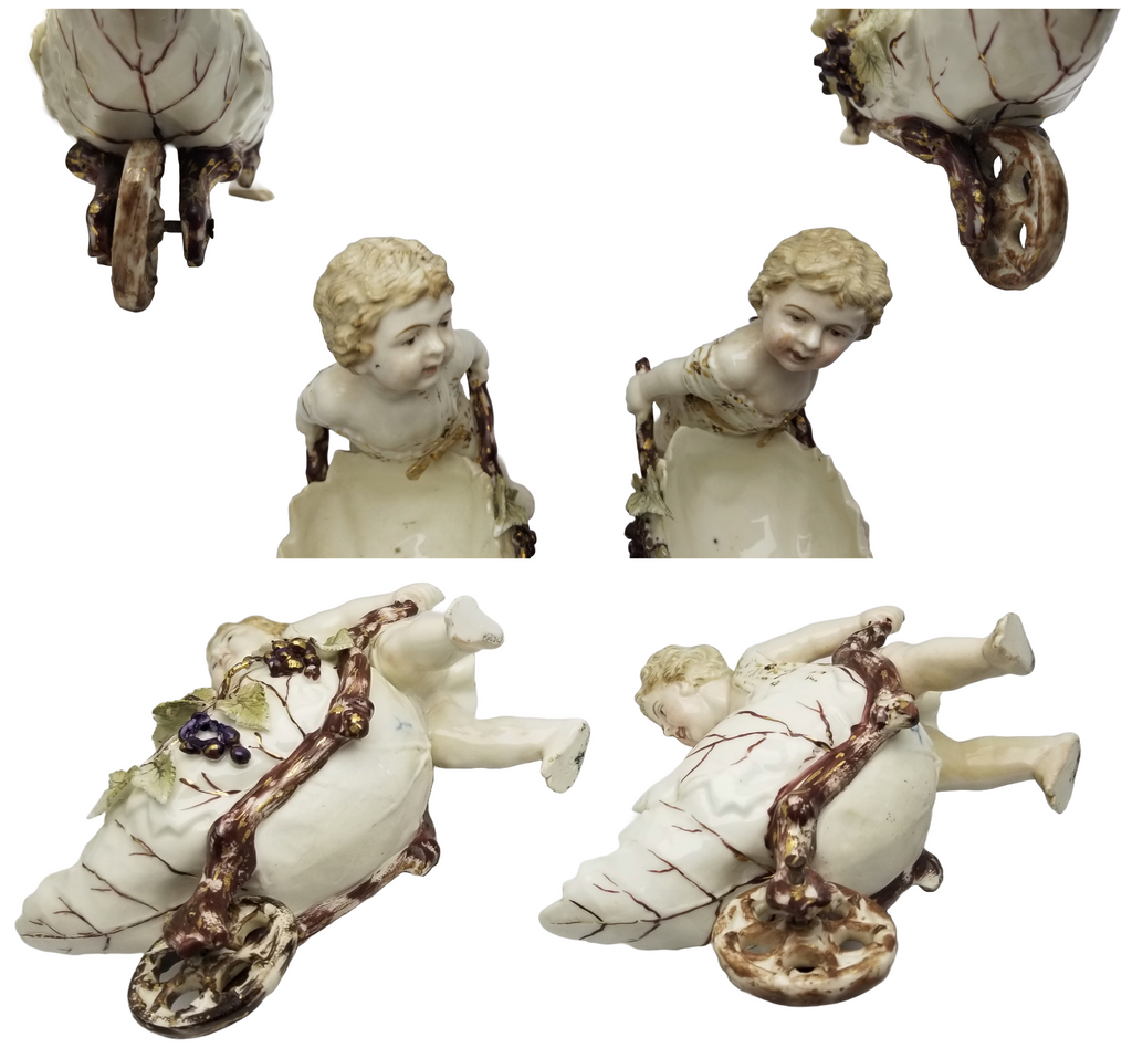 German Porcelain Bisque Garden Cherubs Pair Putti Hand Painted Pushing Wheelbarrows with Moving Wheels Volkstedt Thuringia