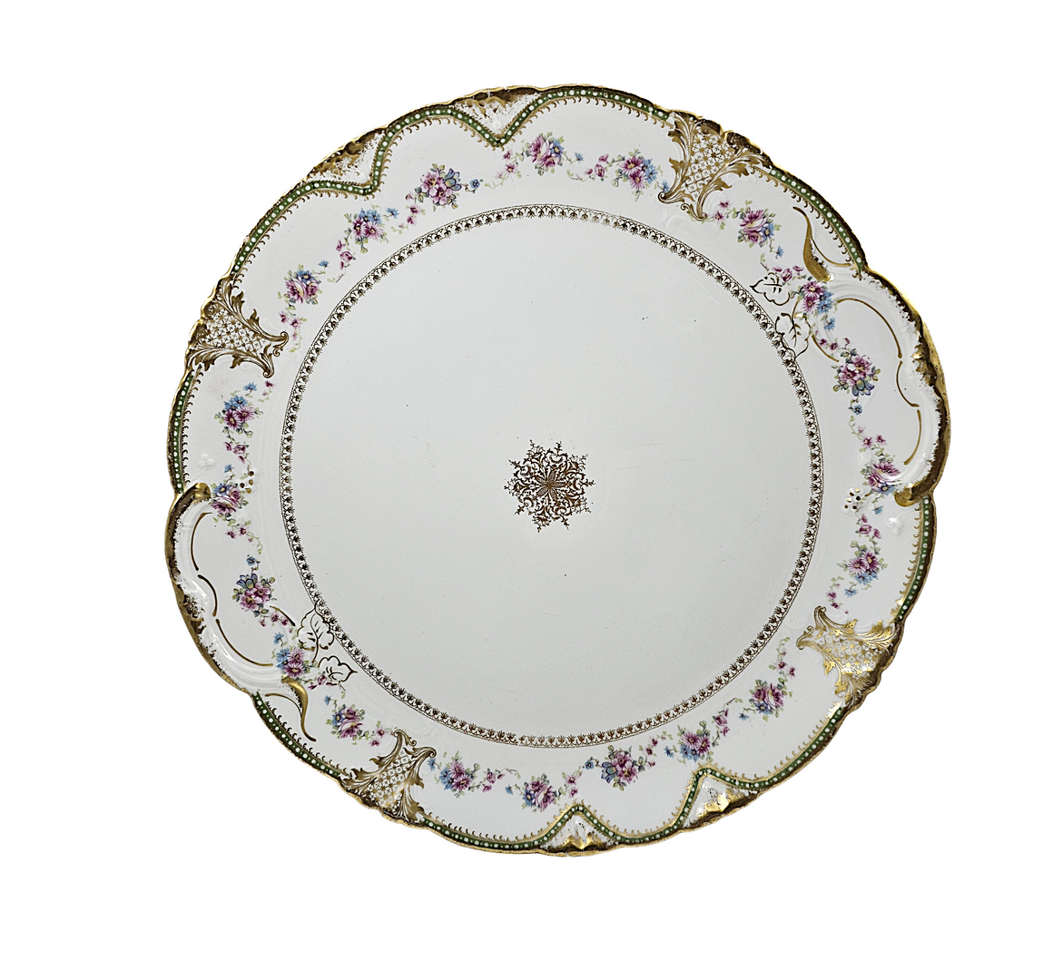 Decorative ceramic plate with floral patterns on a white background