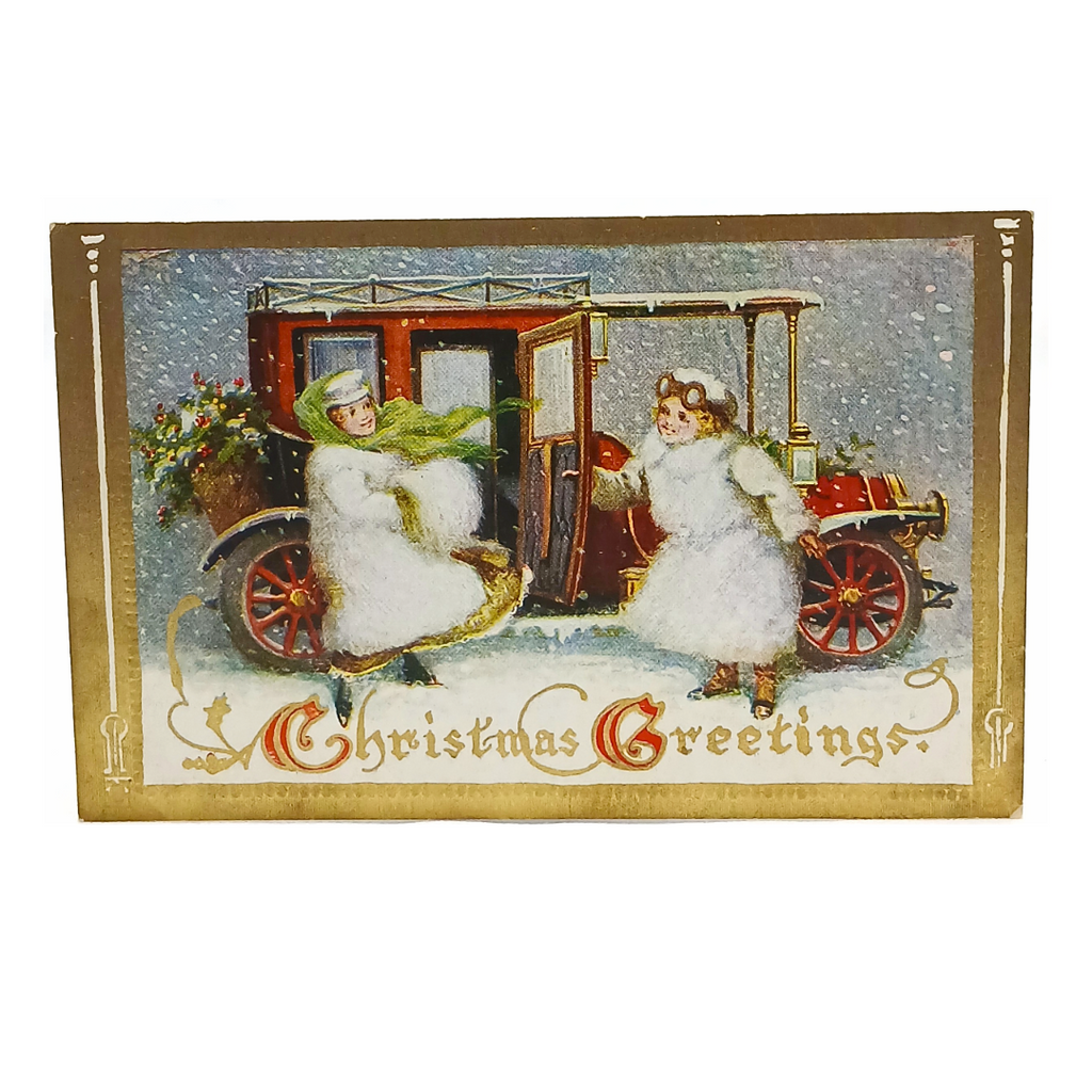 old car with cherubs in snow