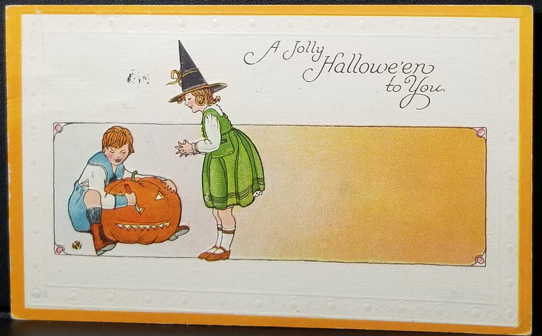 Halloween Postcard Little Girl in Witches Costume Little Boy Carving JOL Pumpkin