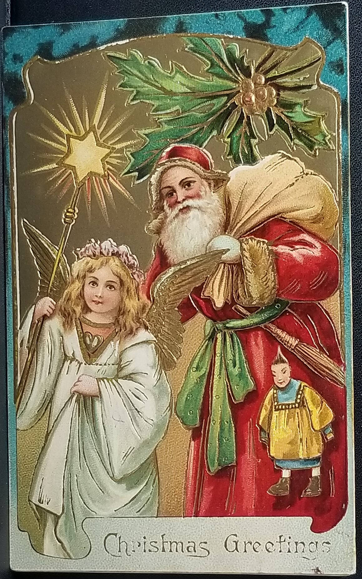 Santa Claus Christmas Postcard St Nick in Red Robe Holding Asian Doll Standing with Angel Gold Embellished Gel Finish