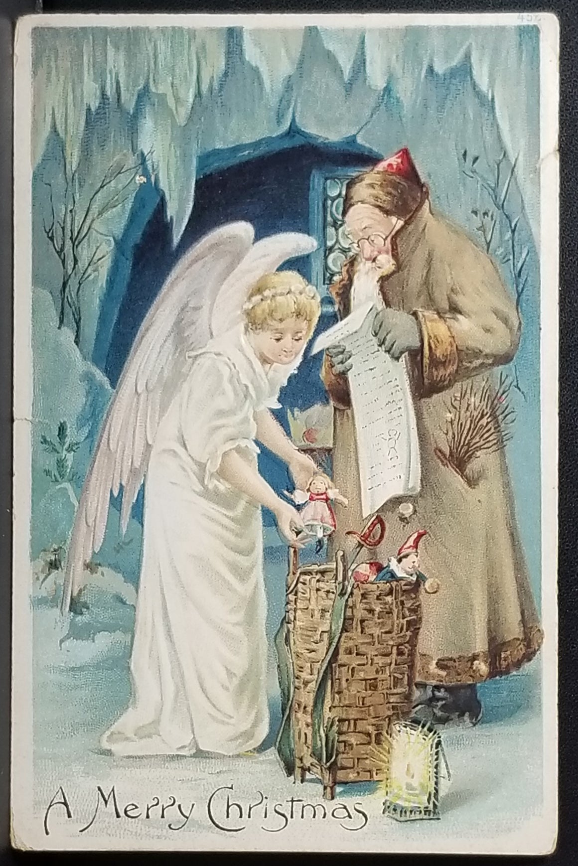 Christmas Postcard Angel Packing Toy Bag with Father Christmas Old World Santa in Brown Robe Reading List
