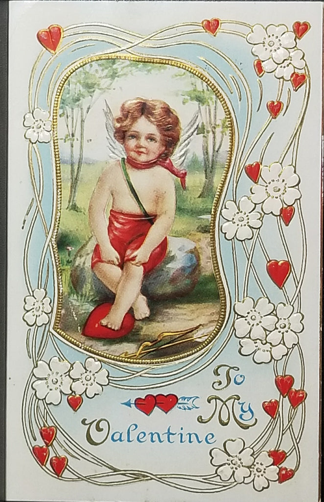 Vintage Valentine Postcard Cupid with Gold Embossed Hearts Seated on Rock