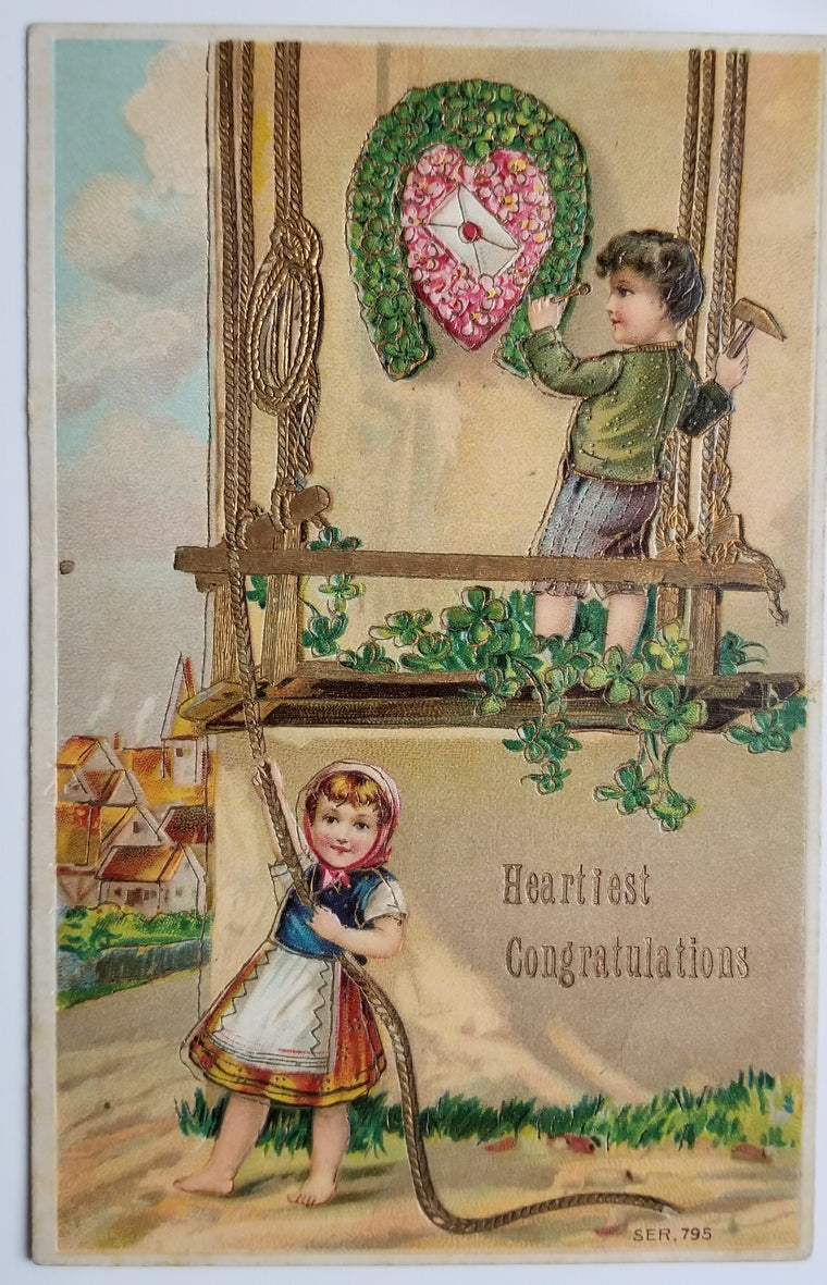 Congratulations Postcard Series 795 Children Hanging Lucky Shoe of Flowers Gold Embossed