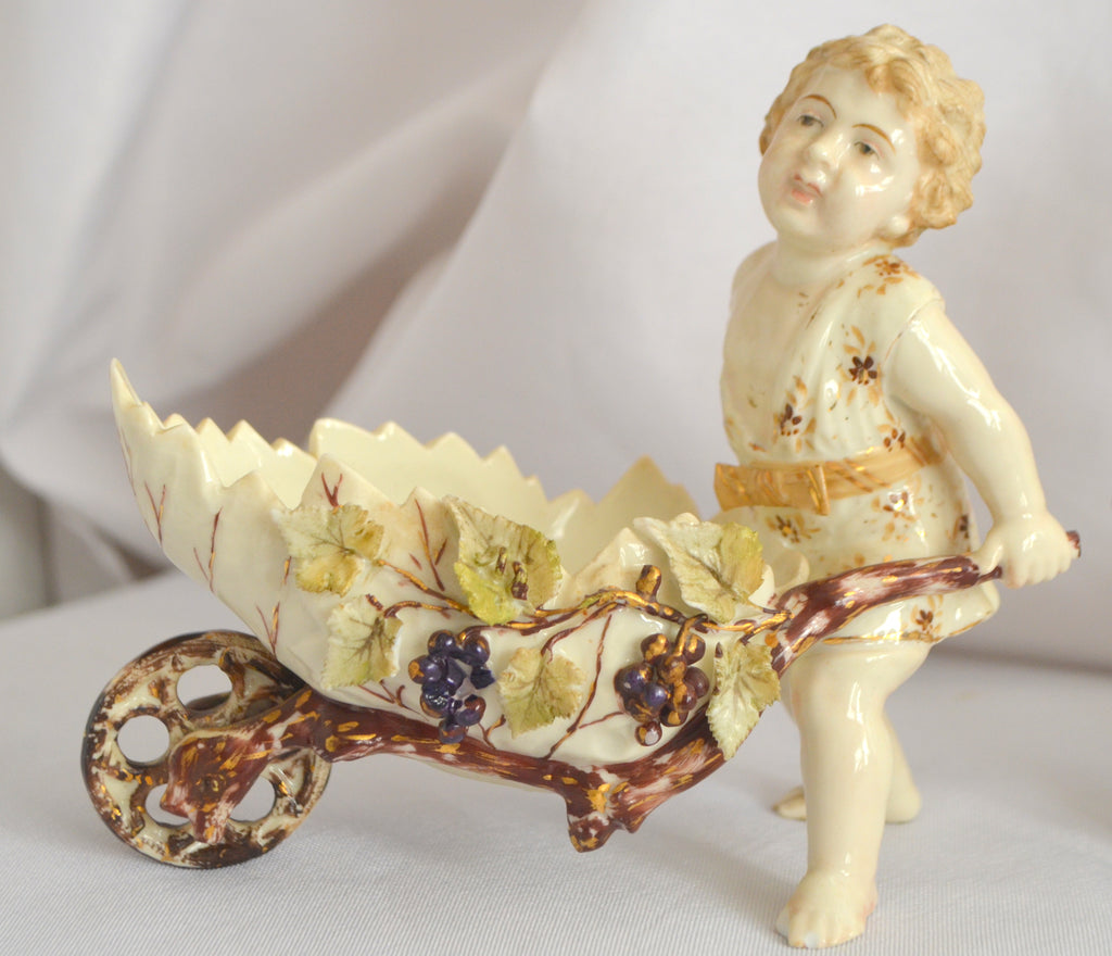 Volkstedt Thuringia Germany Eckert Porcelain Bisque Garden Cherubs Pair Putti Hand Painted Pushing Wheelbarrows with Moving Wheels