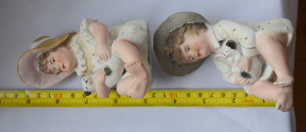German Porcelain Bisque Piano Baby Pair Two Statues Figurines Boy Holding Kitty Cat Girl Holding Puppy Dog Heubach Quality